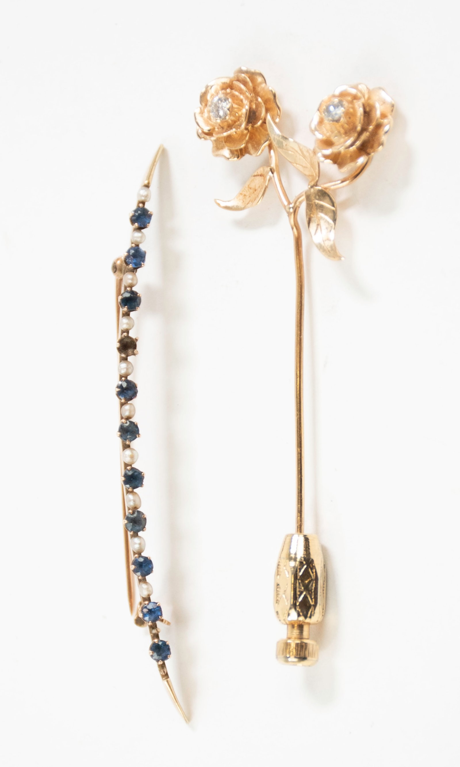 10kt and 14kt Yellow Gold Pins: Qualifies for in-house shipping---1. 14K stick pin having two roses with diamond at center of each bloom totaling .20ct, marked "14K" (clutch not gold), 2 5/8"L, 1"W---2. 10K bar pin with ten natural