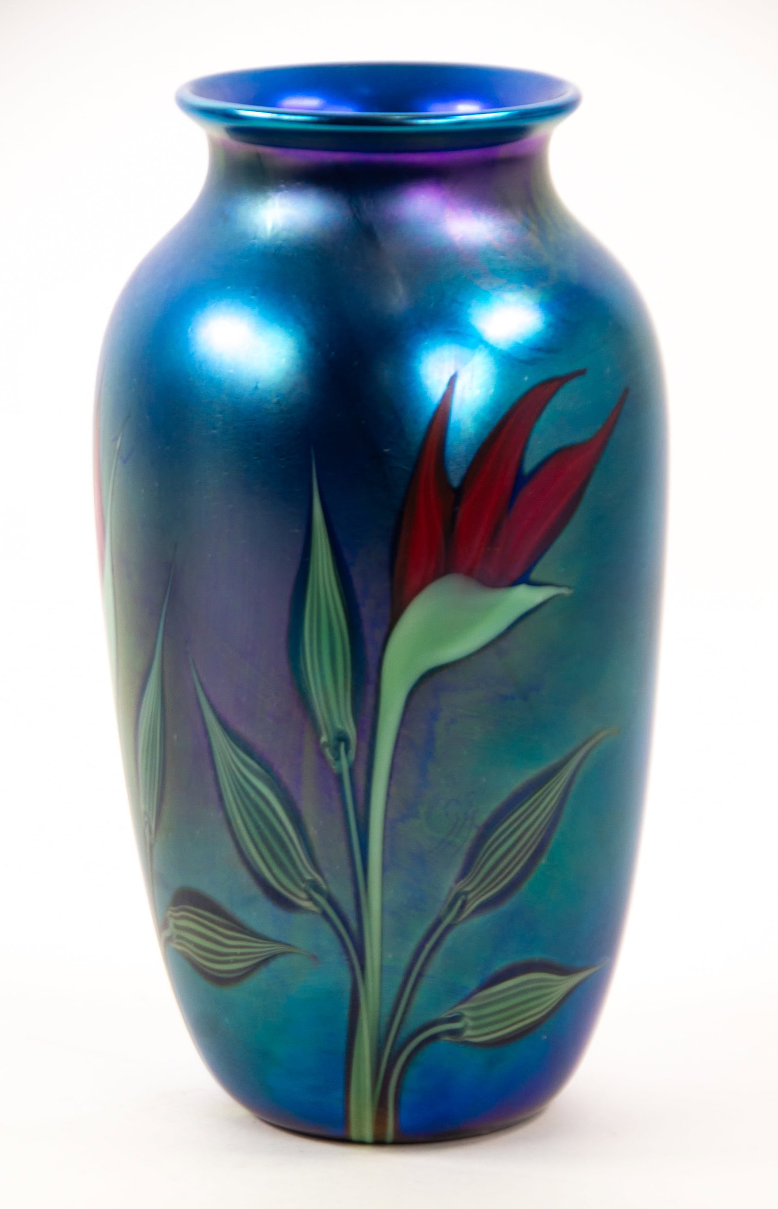 Scott Beyers Orient & Flume Art Glass Vase: Qualifies for in-house shipping---Orient & Flume blue iridescent vase of tapered form with flared rim, decorated on sides with blooming red flowers on leafy stems, signed on base "Beyers / Orient &
