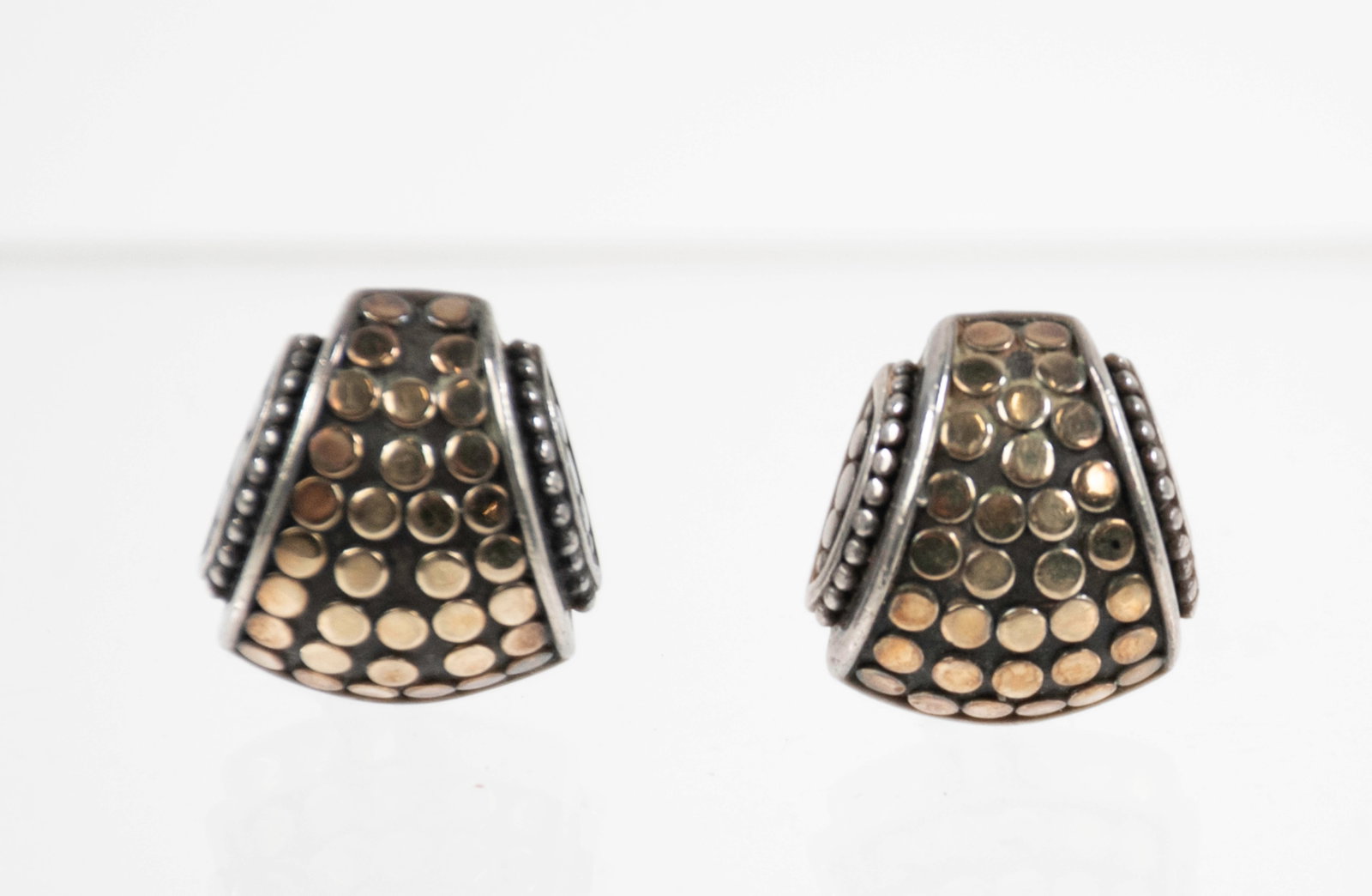 John Hardy 18K and Sterling Earrings: Qualifies for in-house shipping---Sterling silver earrings with 18K yellow gold "Dot" design, post earrings for pierced ears with Omega clip backs; approx. 3/4"L, 5/8"W; total weight 10.39 grams