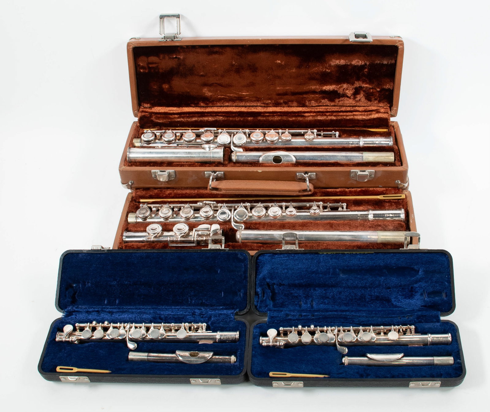 2 Artley Flutes & 2 Artley Piccolos: Qualifies for in-house shipping---Two Artley 15-O flutes, Serial Nos. 430480 and 431010, each in hard case---Two Artley 15-P piccolos, each in hard case---all in good condition with minor dents (Inv.