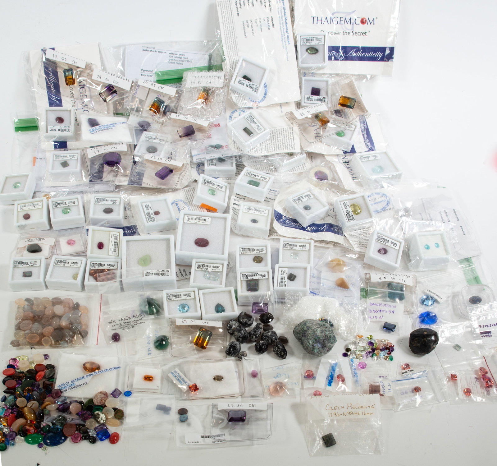 Assortment of Sized & Unsized Loose Gems: Qualifies for in-house shipping---Large assortment of loose gems, several sized and identified by stone, including: Spessartite garnet, 1.35 ct., 7.5 x 6mm oval cut--Paraiba color topaz, 10 x 8mm--Rho