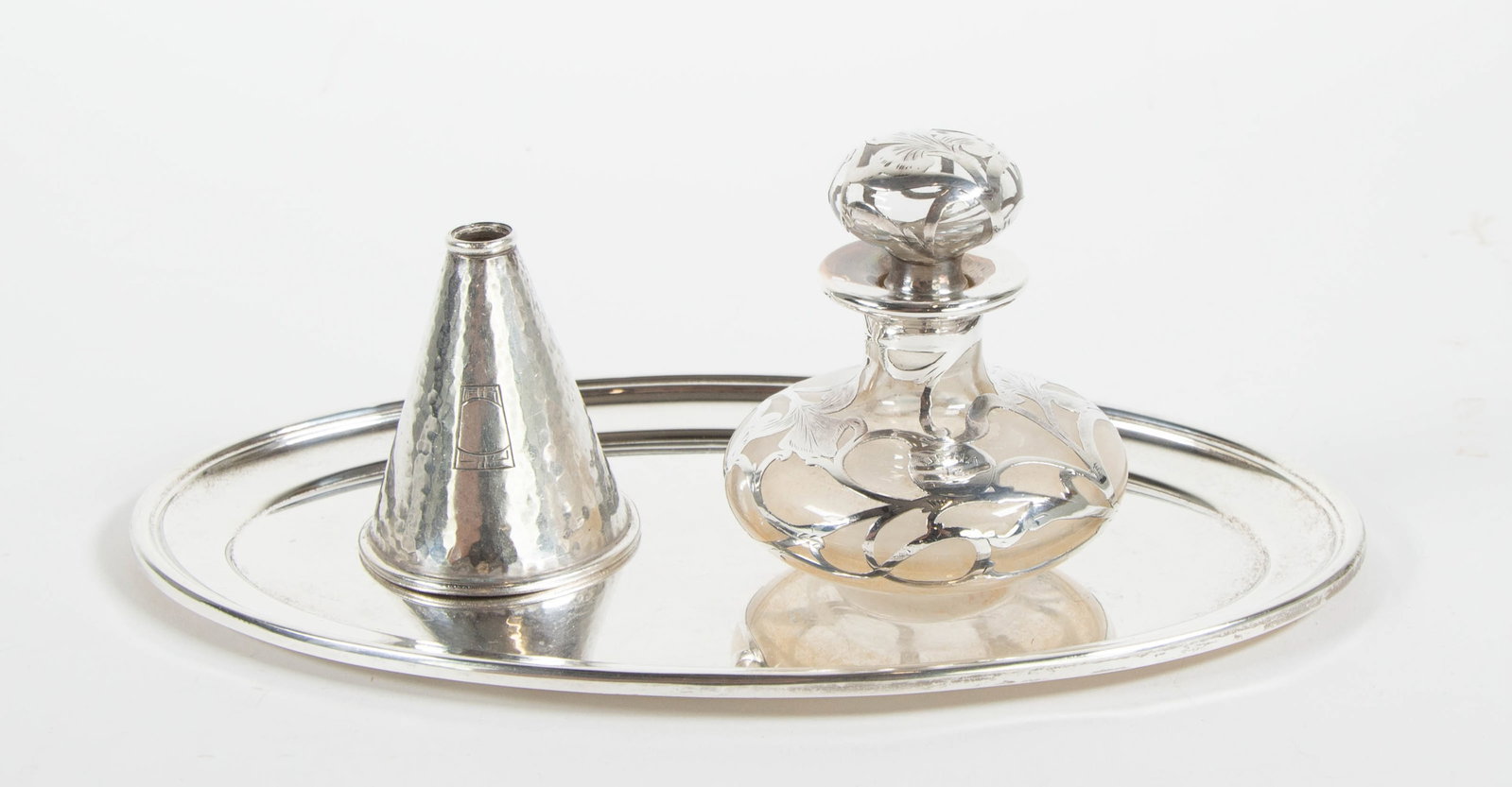 Three Sterling Silver Items: Qualifies for in-house shipping---1. Hand hammered sterling silver funnel, marked for R. Blackinton & Co.; front with engraved Art Deco geometrical design; 2 1/2"H---2. Silver overlay dresser bottle