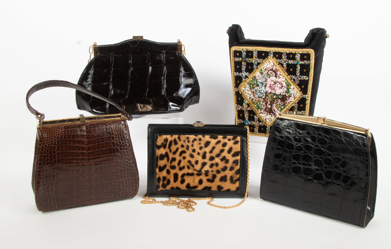 Lot of Five Vintage Handbags: Qualifies for in-house shipping---1. Black leather with leopard print fur (or faux fur) panel on each side, gold chain shoulder strap, goldtone clasp with black oval cabochon, two interior pockets,