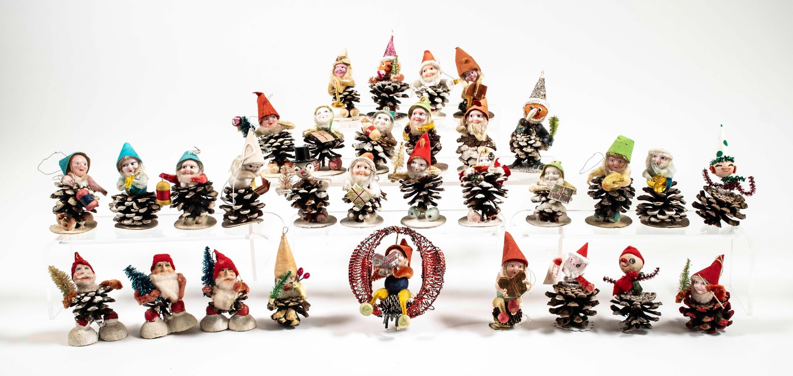 31 Vintage Pinecone Elf Christmas Ornaments: Qualifies for in-house shipping---31 vintage pinecone Christmas ornaments, mostly elves, most mounted on a cardboard base, one seated on pinecone within tin wreath, all with chenille / pipe cleaner