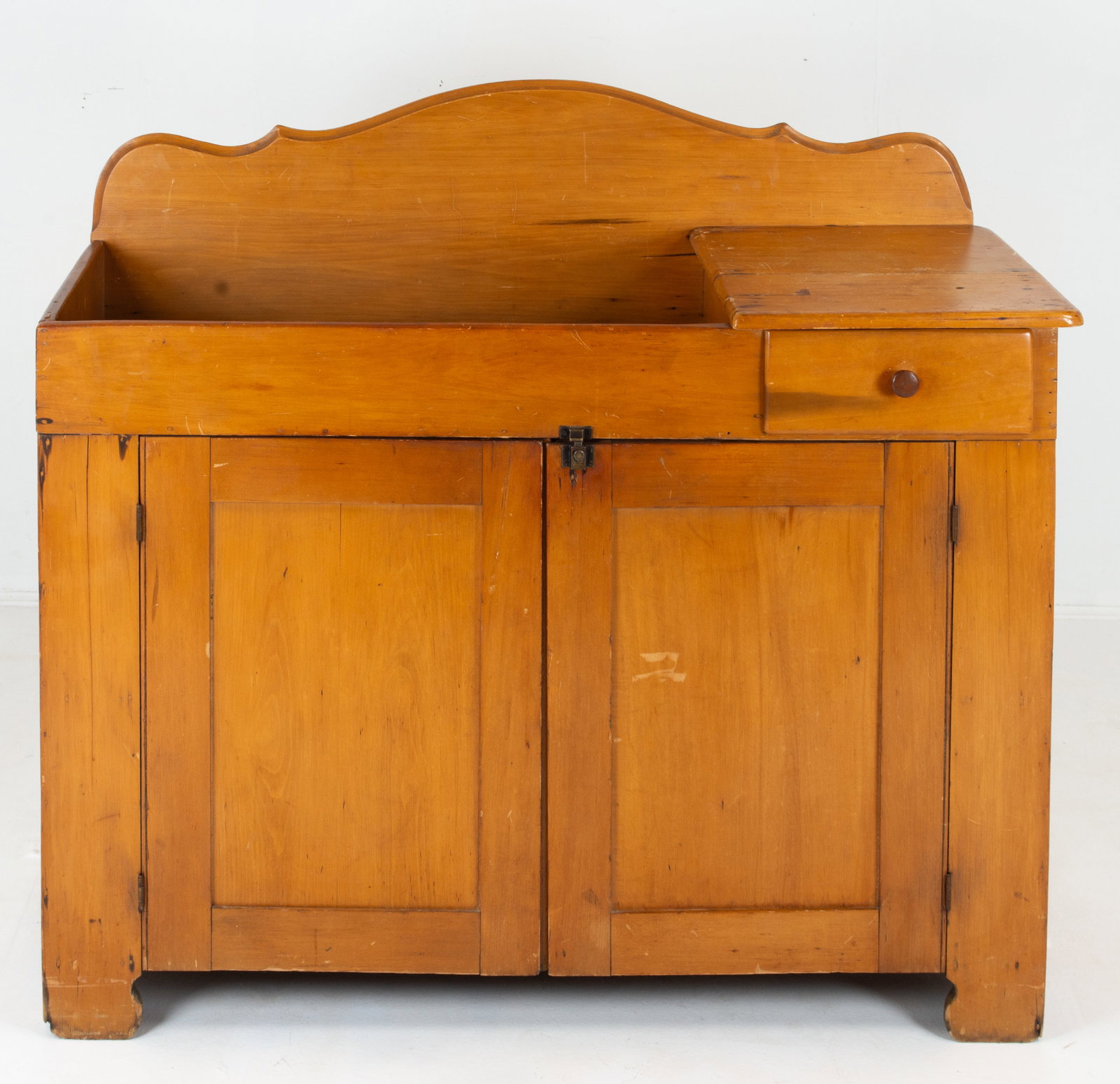 19th C. American Maple Dry Sink: Shaped backsplash over well having a shelf and dovetailed drawer on one side, two paneled doors below open to interior with one shelf; 45"W, 17 1/4"D, 39 3/4"H---This lot does not qualify for