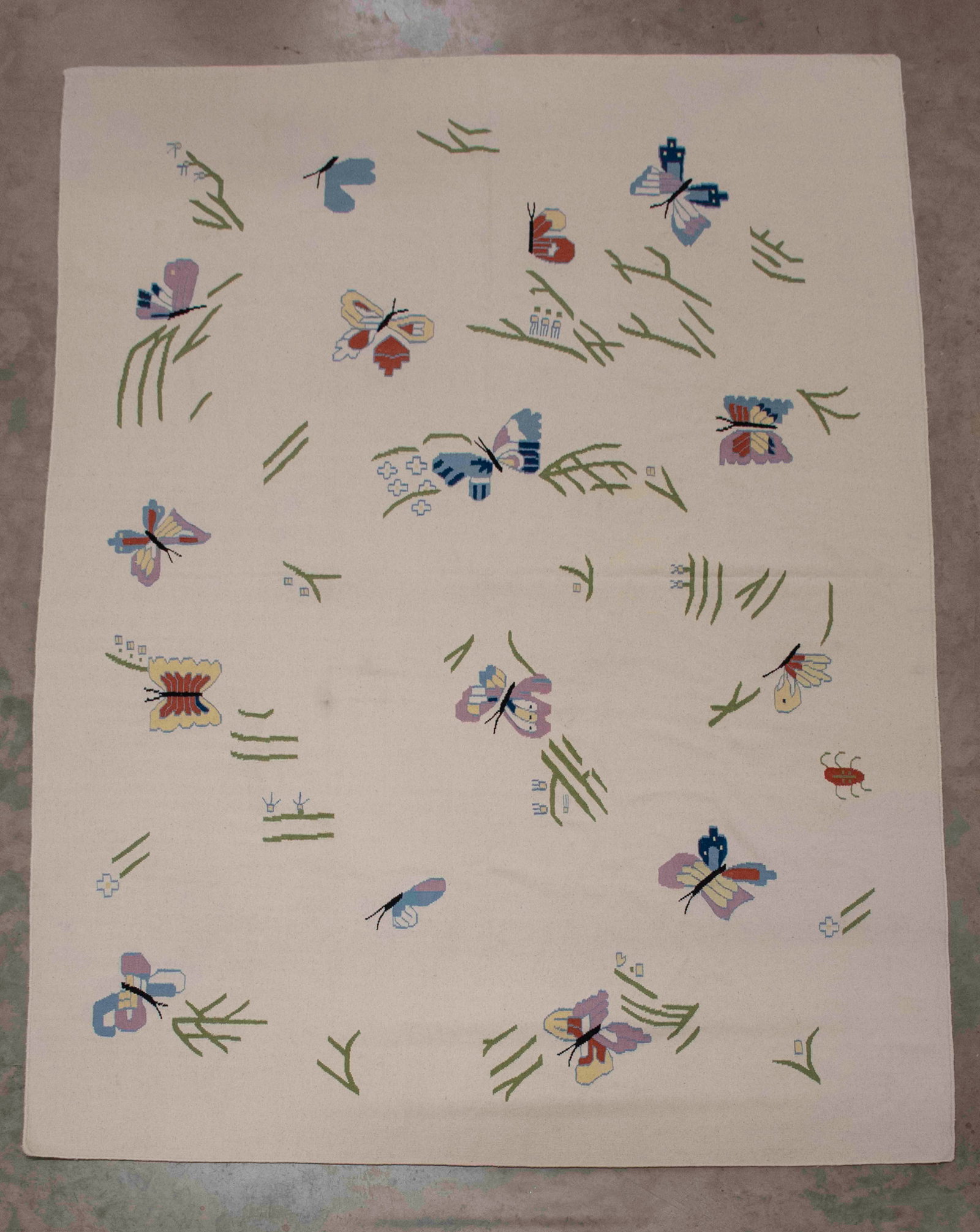 Indian Dhurrie Hand Woven Rug, 9'7" x 13'11": Qualifies for in-house shipping---Multicolored butterflies on an off-white ground; 9'7" x 13'11"; good condition with light soiling