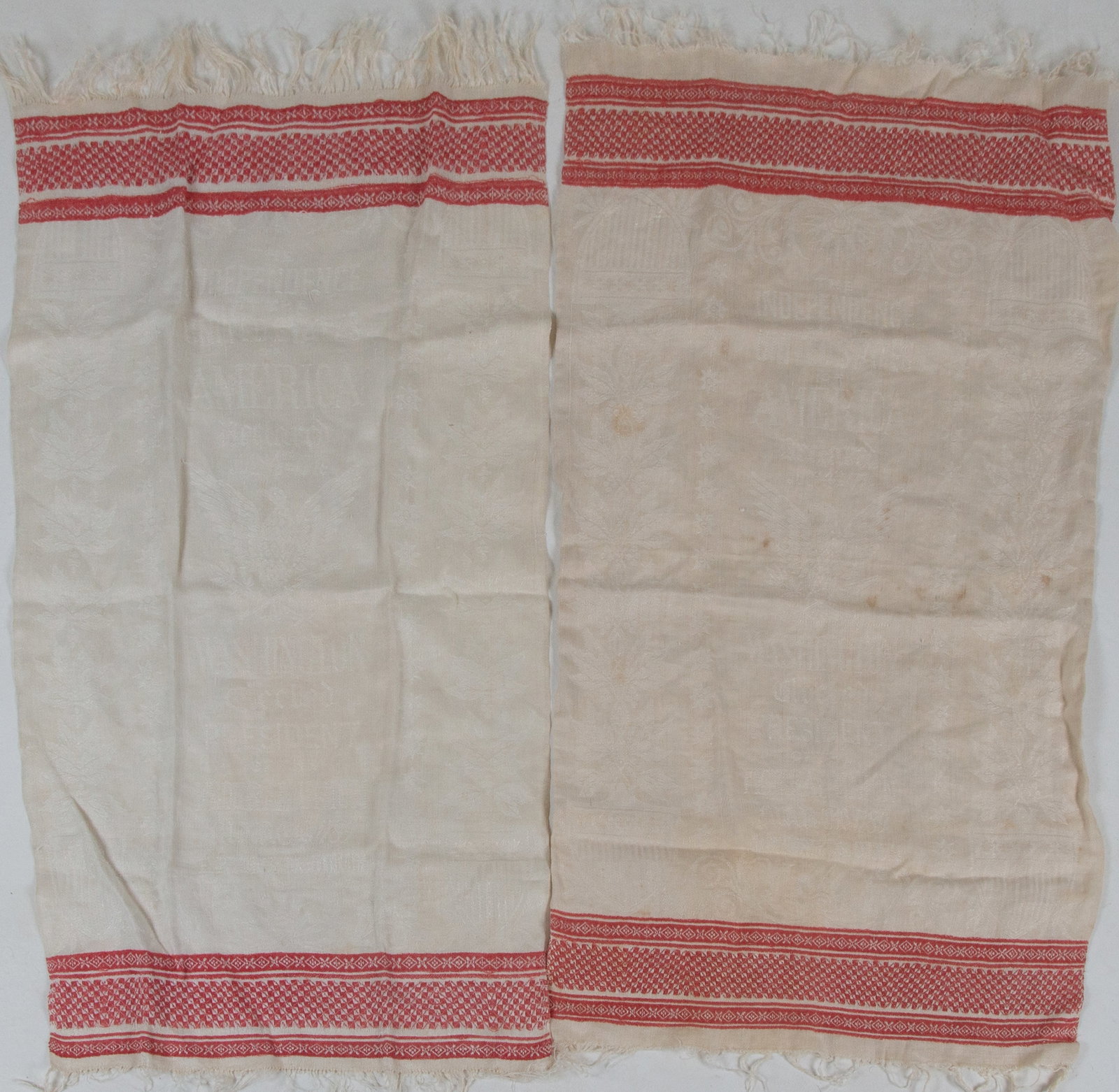 Two United States Patriotic Linen Towels: Qualifies for in-house shipping---Two patriotic turkey red linen show towels, each lettered "THE INDEPENDENCE OF THE UNITED STATES Declared July 4th, 1776" above a spread-wing eagle and shield decorat