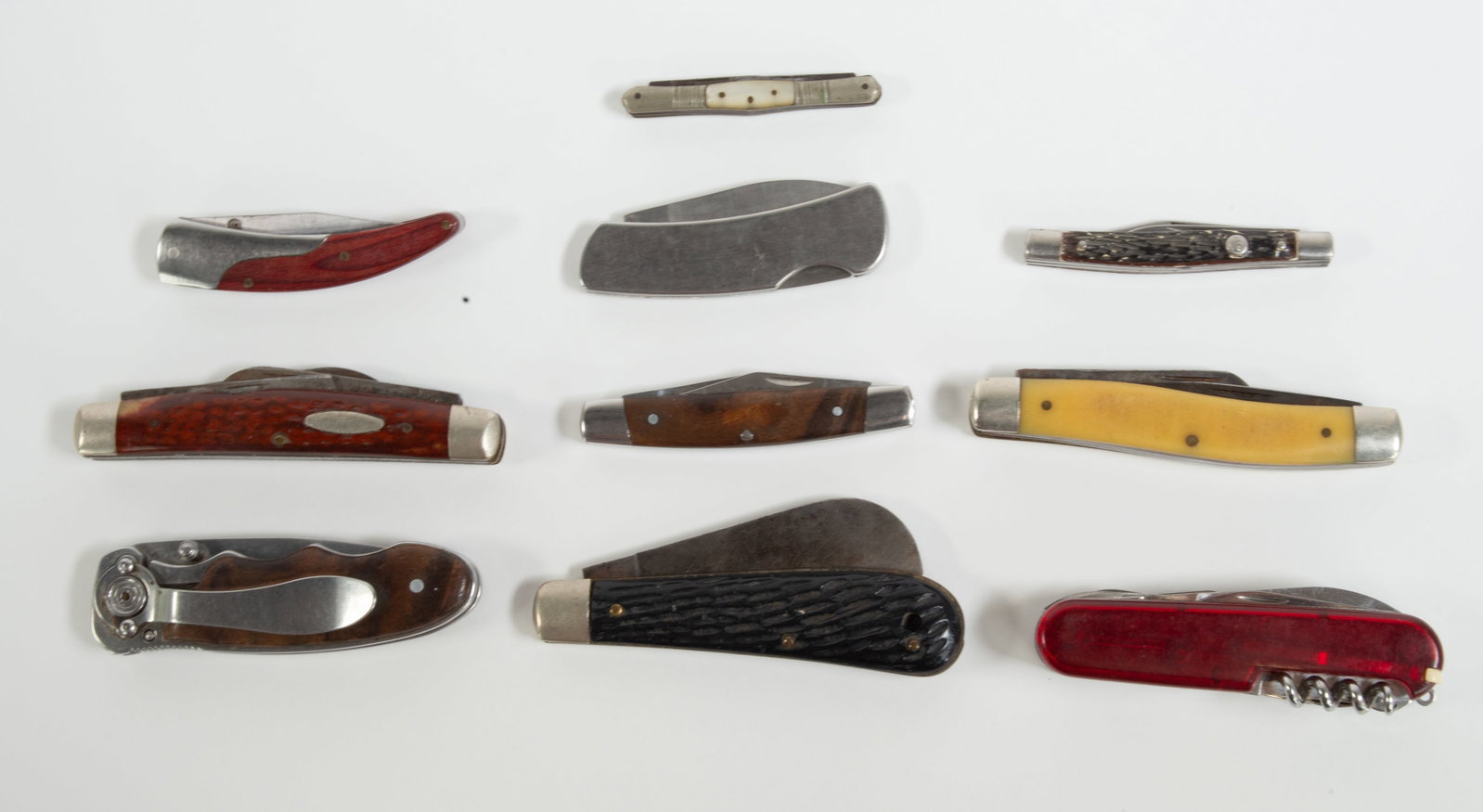 Ten Pocket Knives: Qualifies for in-house shipping---John Primble, Belknap, No. 700 hawkbill knife; 4"L; United Cutlery four-blade small knife; 2 3/8"L; Imperial two-blade knife; 2 7/8"L; Shrade Walden 881Y three-blade 