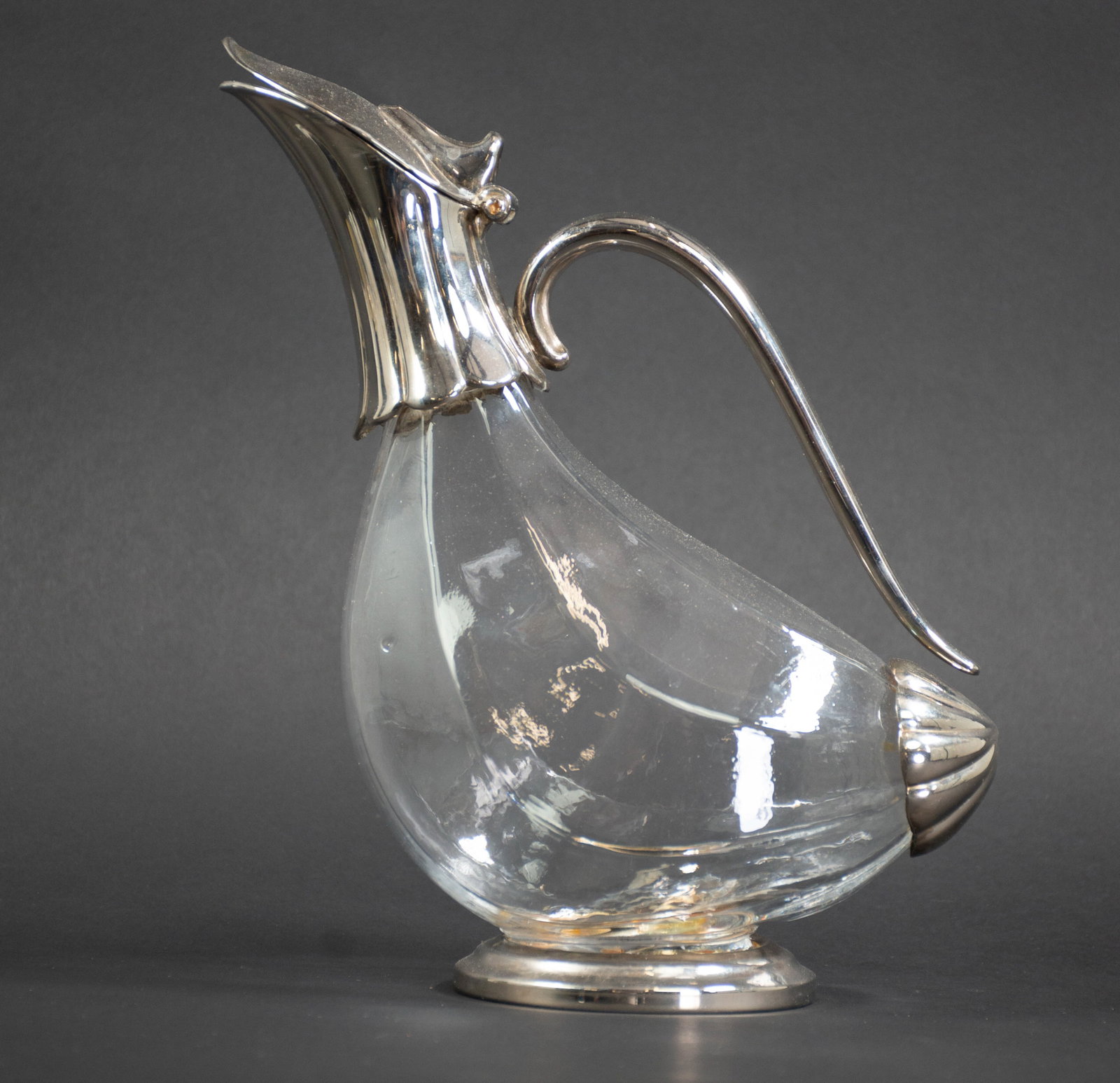 Vintage Duck Form Decanter: Qualifies for in-house shipping---Decanter having a paneled glass body with silverplate mounts in the form of a duck, hinged lid, unmarked; approx. 9 1/2"H, 7 3/4"L, 4"D; good condition