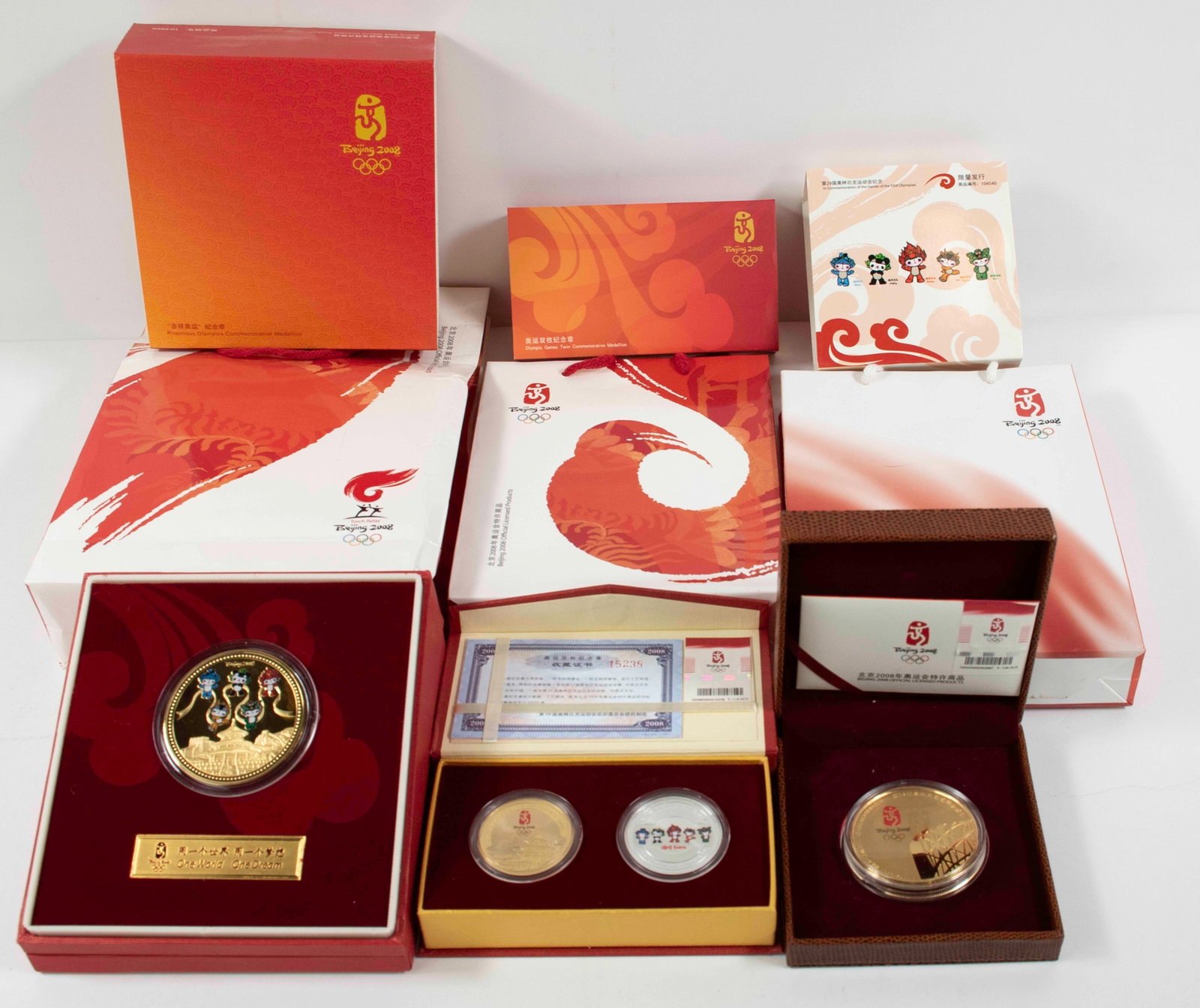 2008 Beijing Olympics Commemorative Medallions: Qualifies for in-house shipping---All in original boxes, with certificates, and with original sacks---1. The Propitious Olympics Commemorative Medallion, No. 12641, gold-plated copper, 2 3/8"
