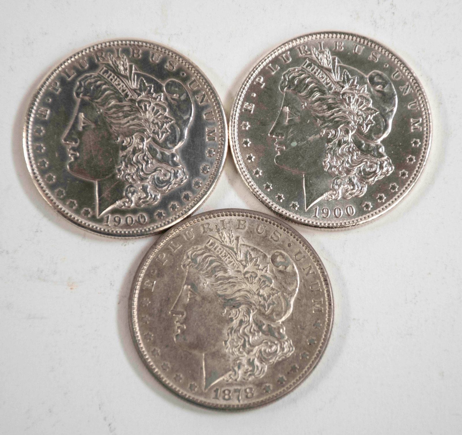 Three Morgan Silver Dollars (1 of 2)