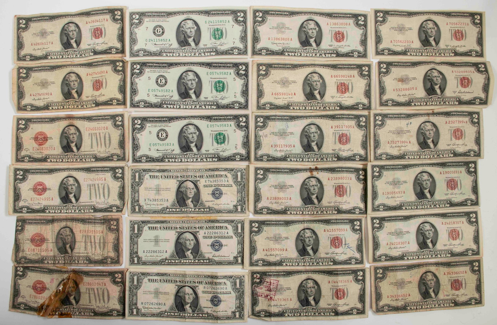 (21) $2 Red & Green Seal Notes, (3) Silver Certif: Qualifies for in-house shipping---Twenty-one red and green seal $20 notes: (4) red seals, Series 1928-G (one with taped repair to tear); (10) red seals, Series 1953; (1) red seal, Series 1953-A; (2)