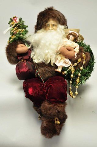Lynn Haney Santa: Christmas Fantasy, Style #3047, c. 1997, seated Santa holding a decorated tree and doll in his arms, original box, 15"H, fabric on one knee slightly discolored