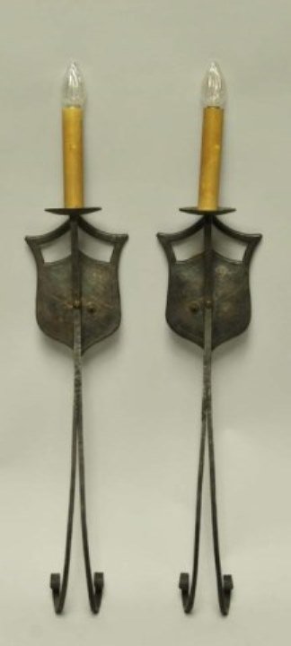 Pr. of Spanish Revival Iron Sconces: Shield back with twin scrolled legs, brass plate applied to bottom of bobeche, at one time hung with prisms, 26"L to top of socket
