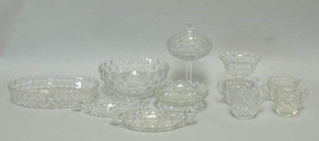 Twelve Pieces of Fostoria American: 1. Oval tri-divided dish, 10 1/2" x 7"; 2. Bowl, 8 1/2" dia., 3 1/2"H; 3. Tri-footed candy dish, 6 1/4" dia., 2 1/4"H; 4. Oval double handled dish, 8 3/4" x 3 3/4"; 5. Oval double handled dish, 8 1/2"