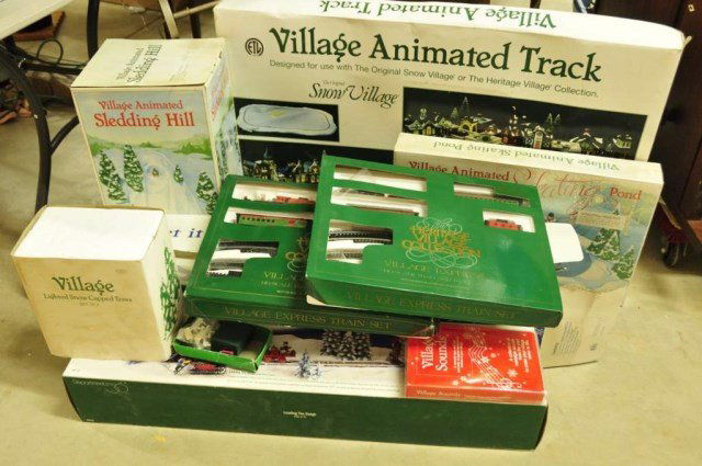 Assorted Dept. 56 Village Animated Accessories: Including: Village Animated Track, Village Animated Sledding Hill, Village Animated Skating Pond, two Village Express Ho-Scale Train & Track Set, Loading the Sleigh, Let It Snow Village Snow Machine,