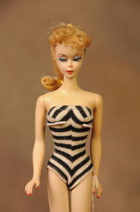 Vintage No. 2 Barbie: c. 1959-60; original black and white striped swimsuit, blonde ponytail hairstyle; accessories include white sunglasses with blue lenses, black open toe heels, fashion booklet; some of hair has been cu