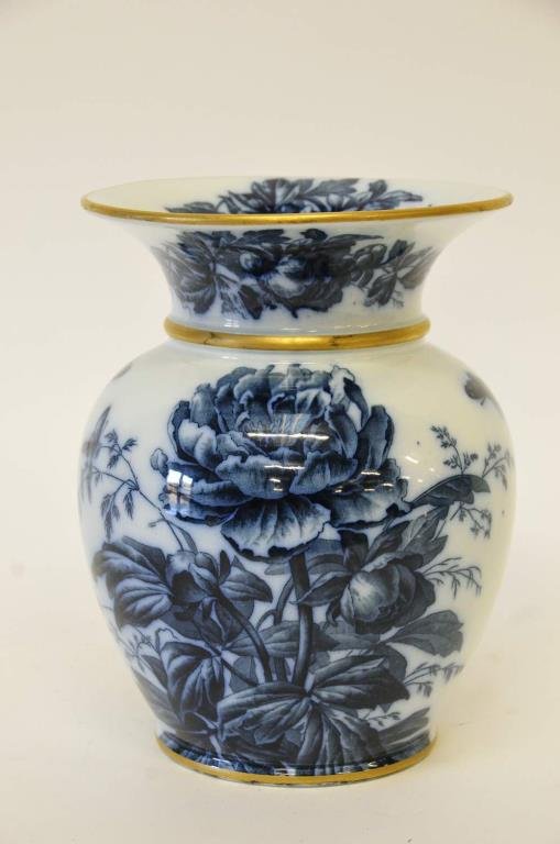 Large English Flow Blue Vase: Late 19th century large flow blue Cauldon vase with flaring rim, extensively decorated with flowers and butterflies, gilt banding accents, bottom stamped "Rd55944 / Cauldon / England", 10 1/4"H, appro