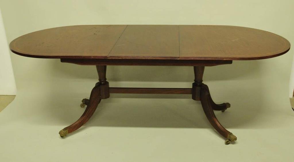 Sheraton Style Mahogany Dining Table: Double pedestal dining table with central medial stretcher, 36"W, 83"L, 30"H; wear and scratches to finish