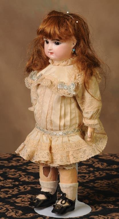 French Raberty & Delphieu Doll: Desirable small size, bisque socket head incised "R 4/0 D", cork pate, multi-stroked eyebrows, brown paperweight eyes with painted upper and lower lashes, closed mouth with lip shading strokes, pierce