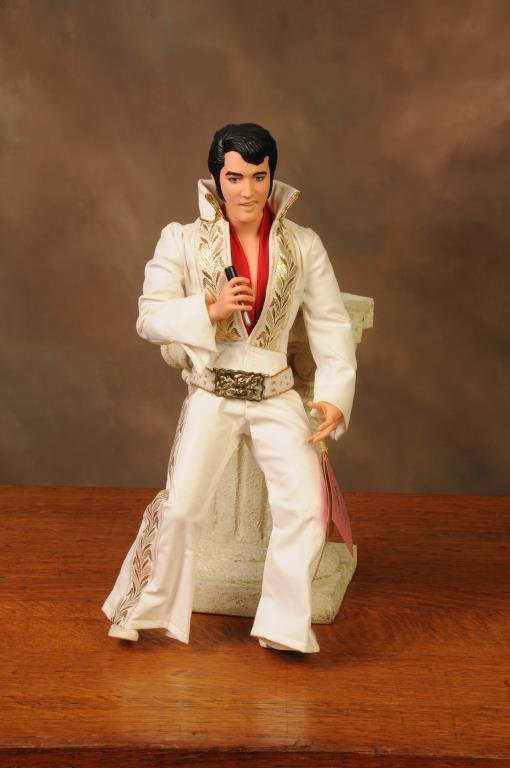 11 Large Character & Celebrity Dolls: 1984 Effanbee 14"H Judy Garland "Wizard of Oz"; 1981 Effanbee 17"H John Wayne; 1966 Libby 19 1/2"H "I Dream of Jeannie" (Barbara Eden) doll; 1984 World Doll 18 1/2"H Elvis Presley with original hand t