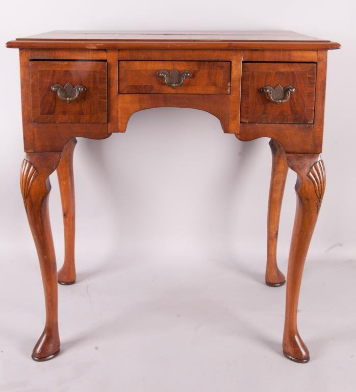 English Queen Anne Dressing Table: Top of burlwood veneer with cross-banded veneer borders and molded edge, three dovetailed drawers, cabriole legs with shell carvings at the knee, late 18th/early 19th century; 26"W, 18"D, 27 3/4"H; sp