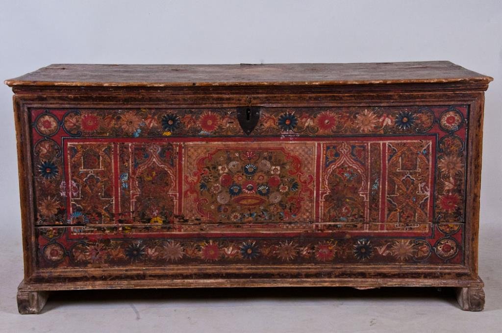 Antique Middle Eastern Painted Chest: 18th century or earlier; top, front and sides with original painted decoration consisting of floral and geometric designs (overpainted at one time, since removed); hand wrought iron snipe hinges, hand