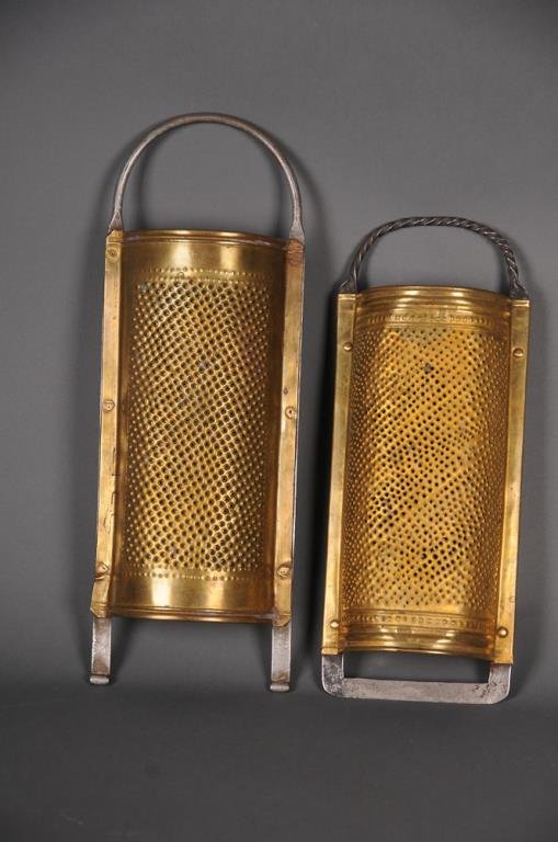 2 Early Pierced Brass Graters: Two pierced brass and iron mounted kitchen graters, English--1st item: Semi-cylindrical brass grater mounted on iron frame with twisted handle, c. 1790-1810; 12 3/4"H, 5"W (See page 228, figure 4, "Do