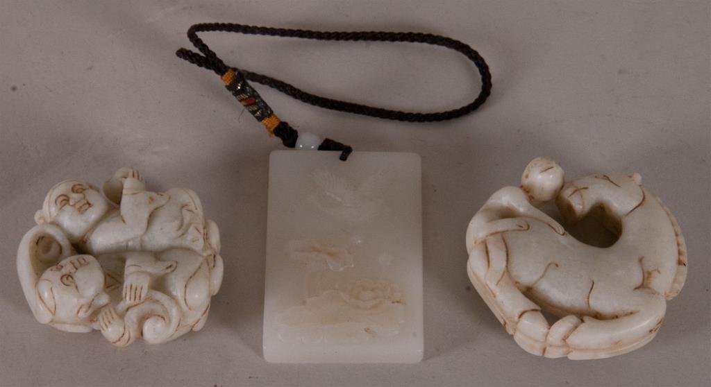 3 Carved White Jade Pendants: Comprising--1st item: Chinese carved white jade rectangular pendant plaque, crane and lotus blossoms to front, 1 1/2" x 2 1/4"--2nd item: Monkey riding on a horse with incised and infilled details, 2