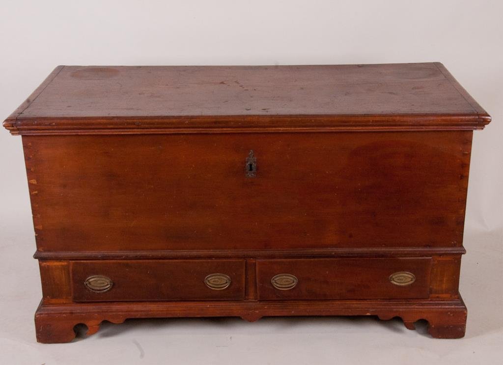 Early American Cherry Blanket Chest: Late 18th/early 19th century American cherry blanket chest, poplar secondary, dovetailed case with two dovetailed drawers, scrolled base and sides with bracket feet; wrought iron handles, lock and hin