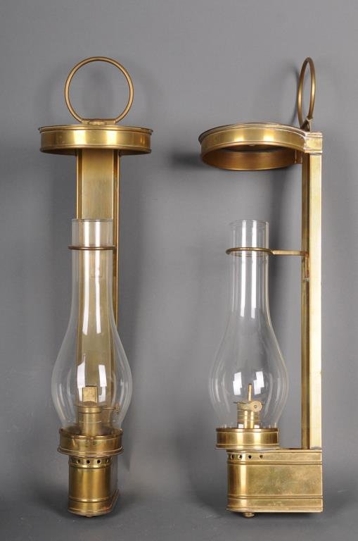 Pr. Brass Wall Lanterns: Pair of brass wall mount lanterns; brass frame, smoke cap, and oil font; glass chimney with brass chimney stabilizer; 20th century, consignor purchased in England; 20"H