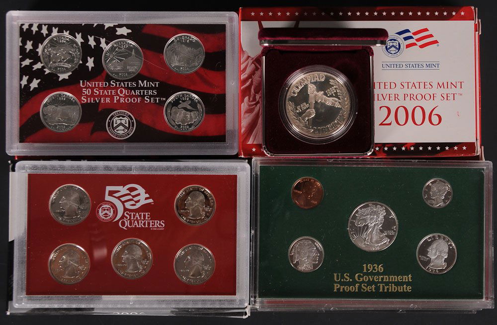 11 Proof Sets: (3) 2006 United States Mint Silver Proof Sets; (3) United States Mint 50 State Quarters Silver Proof Sets (NV, NE, CO, ND, SD); (1) 1988 Proof Silver Dollar United States Mint Olympic Coin; (4) 1936 U