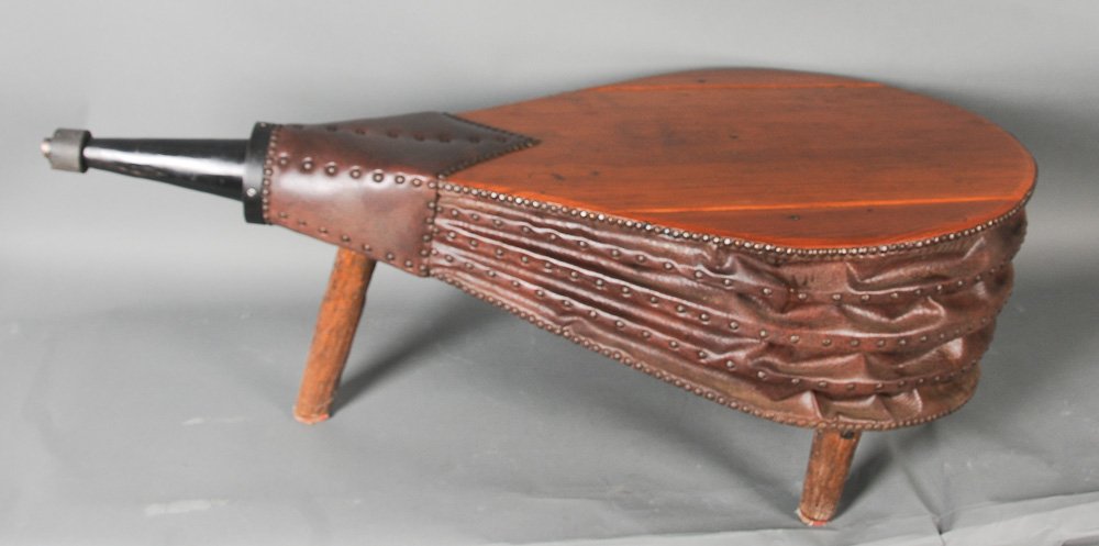 Blacksmith Bellows Coffee Table: Iron, vinyl and wood bellows; mounted on rough hewn wood legs; 53" x 26 1/2", 18 1/2"H