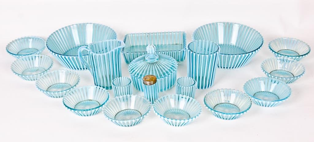 A. J. Beatty Opalescent Glass Pieces Lot of twenty: Lot of twenty Beatty Rib blue opalescent glass pieces including two 8" berry serving bowls and ten 4 1/2" individual berry bowls, a covered butter dish, a 4 3/4"H creamer, a 4 1/2"H celery, a 5" x 7 1