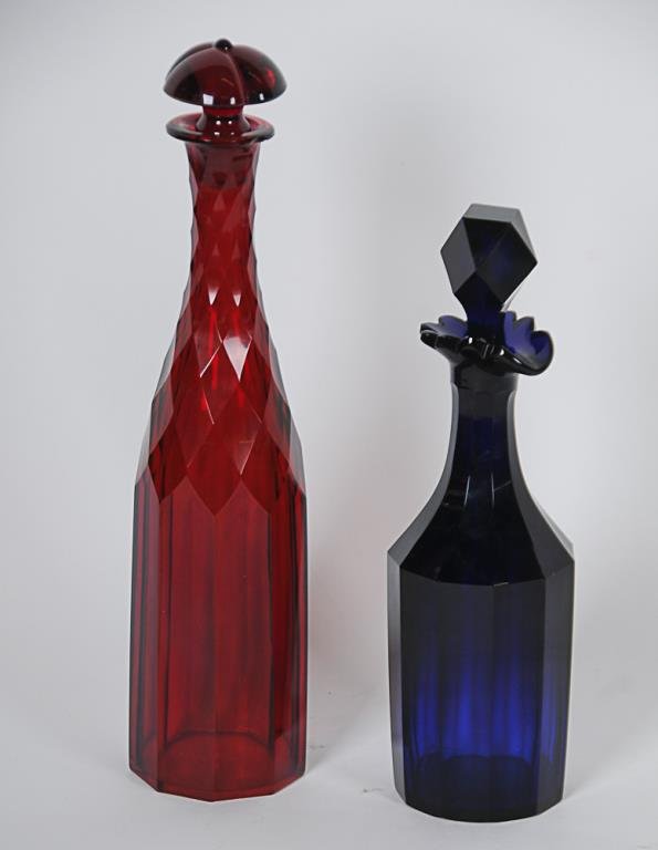 Cobalt & Ruby Cut Glass Decanters Paneled cobalt: Paneled cobalt decanter with spout and scalloped rim, 16-point star cut to base, faceted stopper, 11"H, several small chips to cut edges of stopper, flea bite chips to cut edges and bottom rim of deca