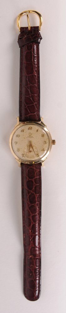 Gentleman's Omega Wristwatch Gentleman's gold plated: Gentleman's gold plated Omega Automatic wristwatch, circular face with second hand and gilt metal Arabic numerals, brown leather band not original; in working condition at time of cataloging; spots of