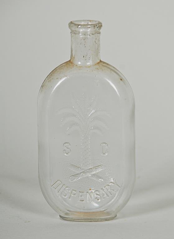 South Carolina Dispensary JoJo Flask Clear half pint: Clear half pint flask No. 140 (listed as comparatively scarce) with Palmetto tree--Reference Book: [The South Carolina Dispensary a bottle collector's atlas and history of the system] by Phillip Kenne