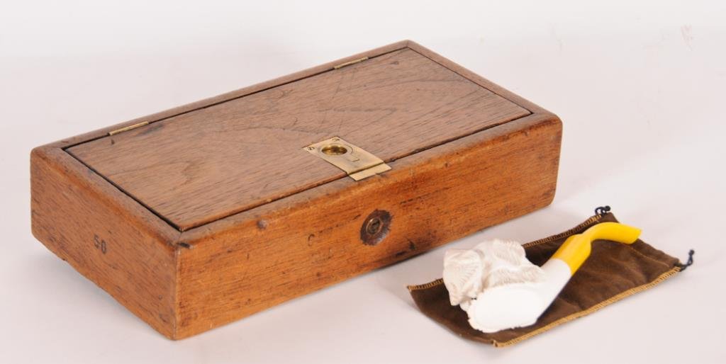 H. Upmann Cigar Box & Meerschaum Pipe Walnut cigar box: Walnut cigar box with brass flush finger pull, spring loaded latch and lock, interior of hinged lid incised "H. Upmann / Habana", sides incised "50", bottom incised "Patent No. 1326" inside oval, remn