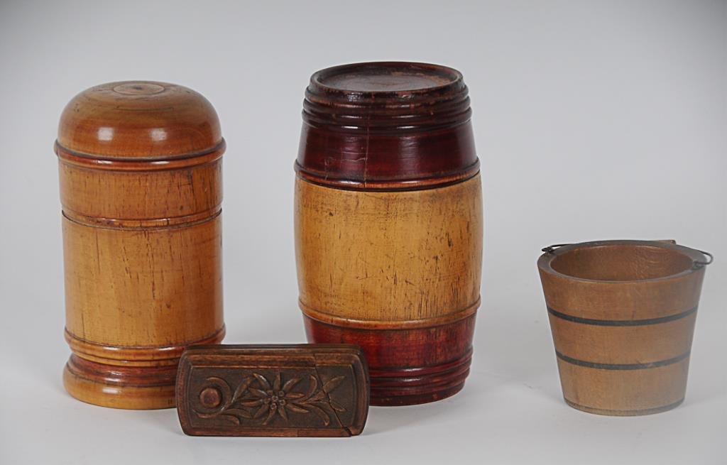 Lot of Early Treenware Four pieces: Barrel shaped box: Four pieces: Barrel shaped box with painted and ribbed decoration on base and lid, maple, 5"H--Cylindrical maple box with dome shaped lid, remnants of red paint, 4 3/4"H--Miniature bucket with painted