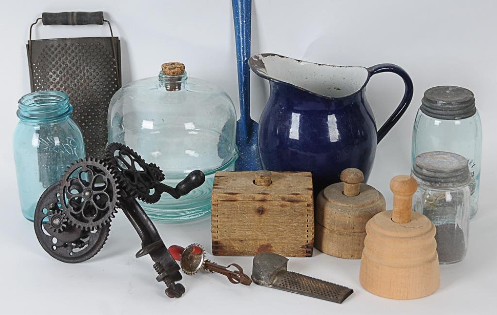 Lot of Early Kitchen Related Items 13 items, including:: 13 items, including: Sinclair Scott Co., Baltimore, cast iron apple peeler--Three wooden butter molds--10 1/4" x 5 1/2" tin grater with wooden handle--5 1/4"L tin nutmeg grater--Miniature egg beater--