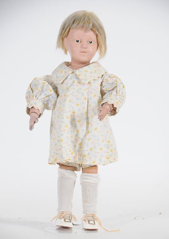 Schoenhut Doll: Wooden body with socket head, intaglio eyes and open mouth, double jointed legs and arms with steel springs, back marked "Schoenhut Doll / Pat. Jan. 17th 1911 / U.S.A.", 14 1/2"H, chips and losses to