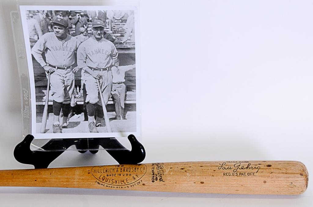 Lou Gehrig Bat and Photo w/ Babe Ruth: 1st item: c. 1930s Hillerich & Bradsby Co. Louisville Slugger Model 125 Lou Gehrig stamped baseball bat, 36"L, very good condition--2nd item: 8" x 10" black and white photo depicting Lou Gehrig and Ba