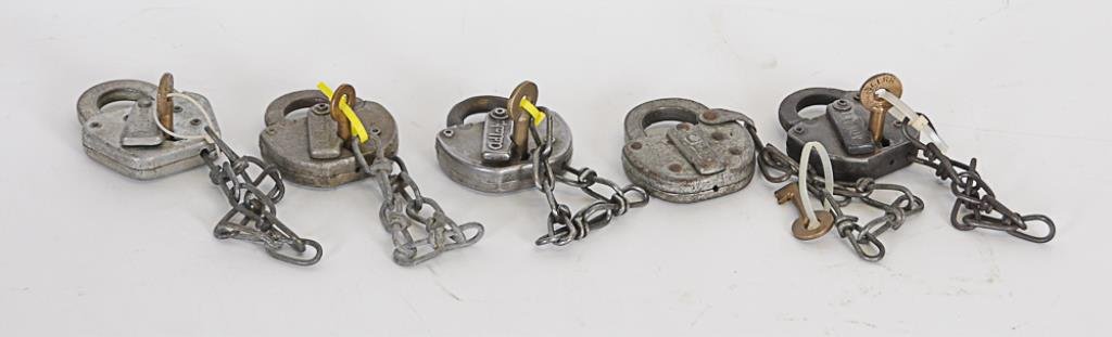 Set of Five Antique Railroad Locks w/ Keys: American, 20th century, set of five antique railroad padlocks with chains and keys including: Three by Adlake (one marked NYCS for New York Central System with W. Bohannan, Brooklyn, NY, key; one mark