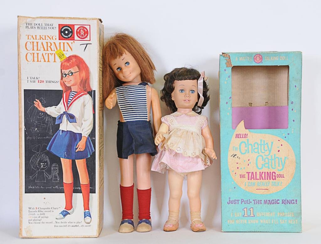 1961 Chatty Cathy & 1962 Charmin' Chatty: Two Mattel talking dolls, both with original boxes: 1961 Chatty Cathy; brunette with blue eyes and freckles, pink peppermint striped dress with pinafore, original shoes and socks, pink ribbon in hair,