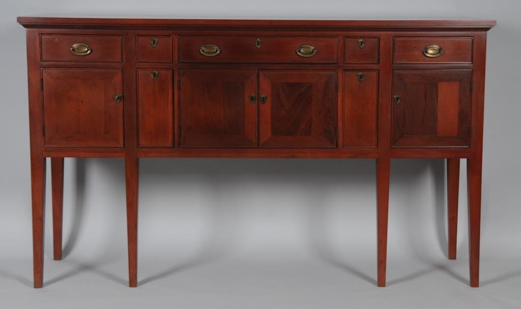 Craftique Style Sideboard: Mahogany; four doors and seven drawers all with cockbeading, shield-form escutcheons, tapered legs; width 68 in., depth 19 1/4 in., height 39 3/4 in.; good condition