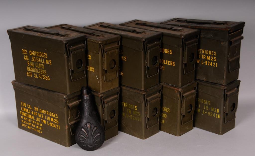Copper Powder Flask & 10 Metal Ammunition Cans: 19th century copper powder flask with shell design, length 8 1/4 in., small dents, carrying rings missing---Ten metal ammunition cans; seven made by GP&F, two by EMCO, one by United; good condition wi