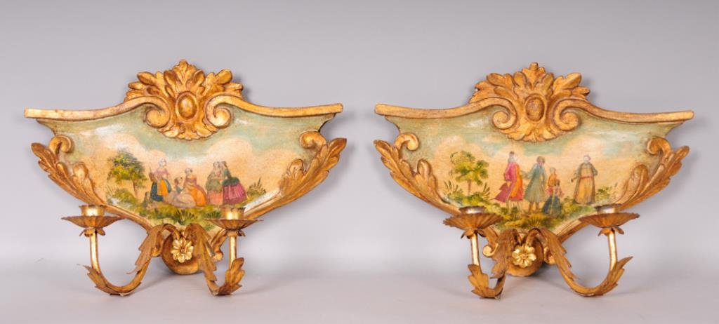 Pair of French Sconces w/ Figural Scenes: Pair of Louis XVI style two-light sconces, carved gilt wood back plates with transfer and hand painted scenes depicting several figures conversing in an exterior setting, two scrolled gilt metal arms 