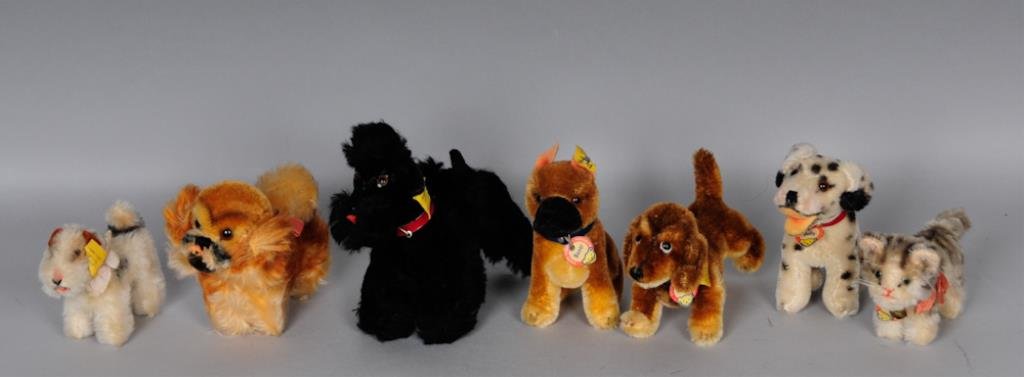 c. 1950s Steiff Miniature Toy Grouping: Seven miniature c. 1950s Steiff toys: "Hexie" dachshund dog No. 1309, with paper name tag, ear button and ribbon; length 6 in., height 3 1/2 in.----Sitting "Boxer" dog, with paper name tag, ear button