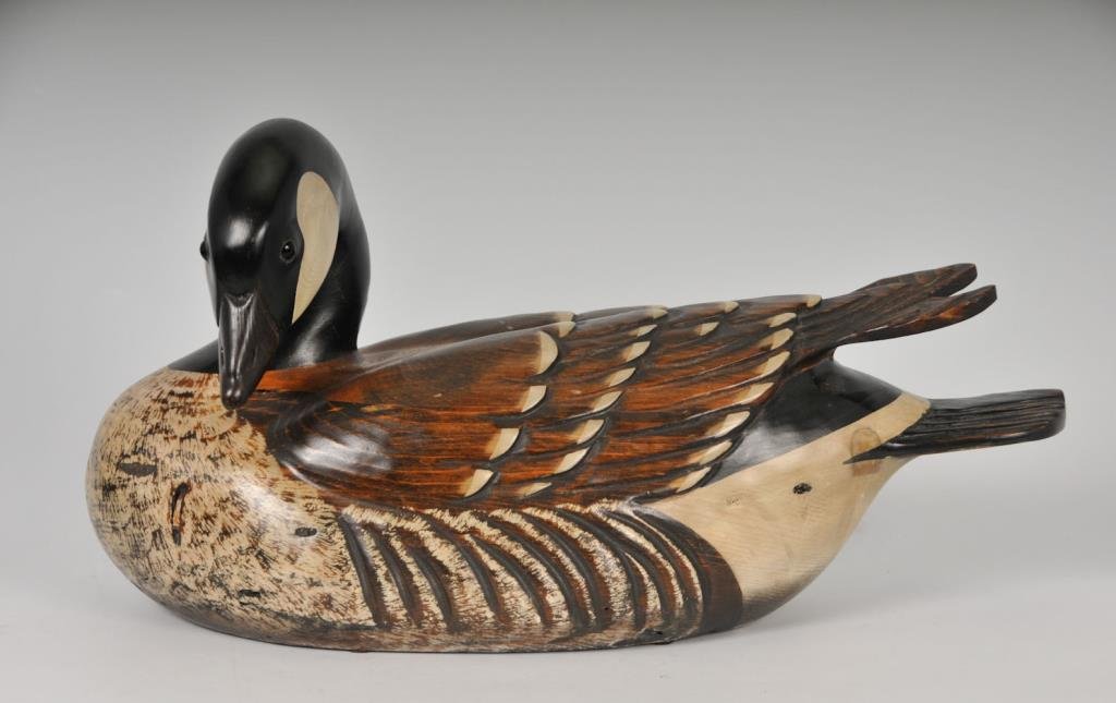 Tom Taber Carved & Painted Duck Decoy: Base with circular metal inset "Ducks Unlimited Special Edition 1992-93) and signed "Tom Taber"; approx. 19"L, 8"W, 10"H; good condition (Ref. 288)