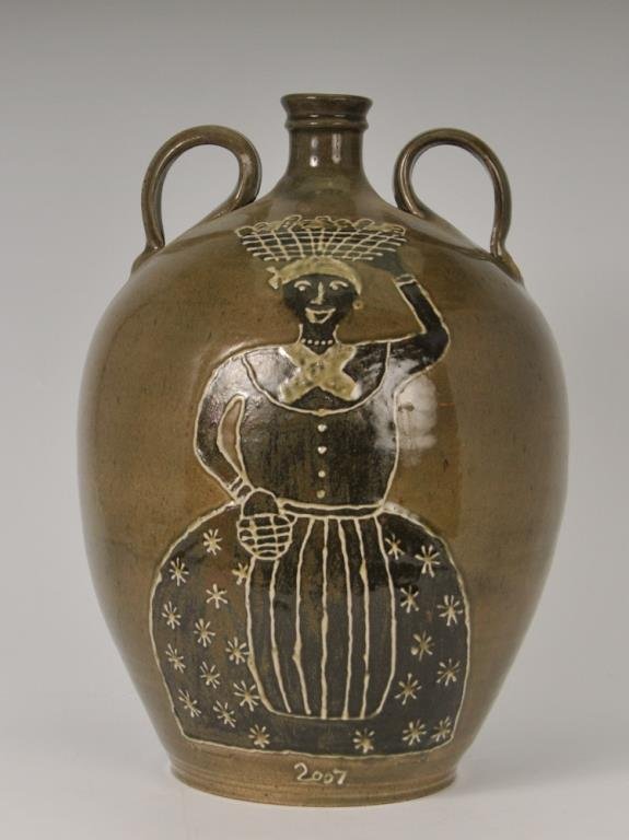 Ed Redman, Large S. Carolina Double Handled Jug: Front decorated with a brown and white slip decoration of female with a basket atop her head, dated 2007, stamped "E. Redman" for Ed Redman, Old Edgefield Pottery; 18"H (Ref. 159-1)